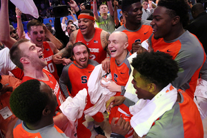 Syracuse celebrates it's win over then-No. 25 Texas A&M, which helped it gain a No. 14 ranking in the latest Associated Press poll. 