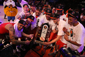 Syracuse players pose for photos with the Battle 4 Atlantis championship trophy after defeating Texas A&M 74-67.